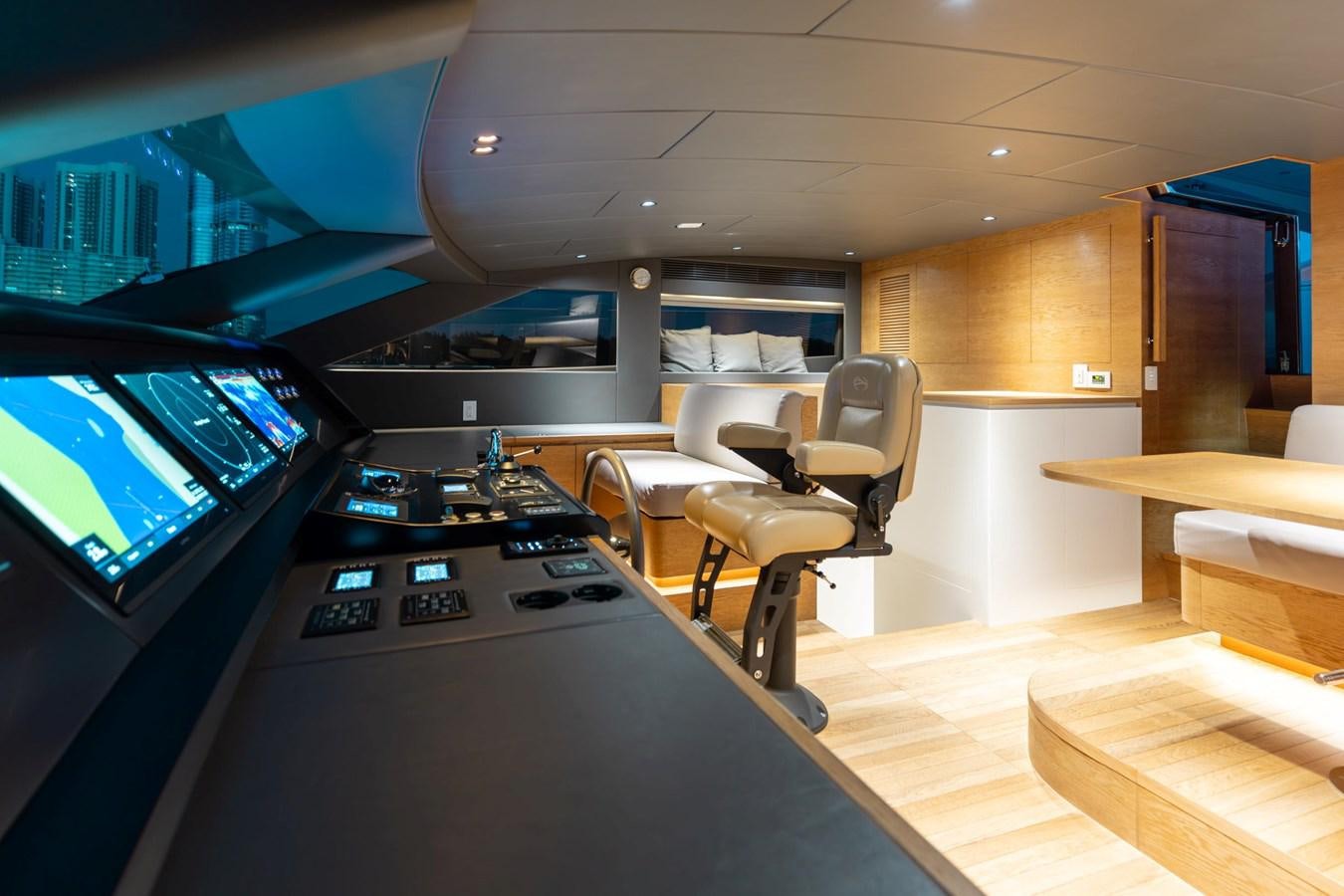 a room with a desk and chairs aboard ADAGIO Yacht for Sale