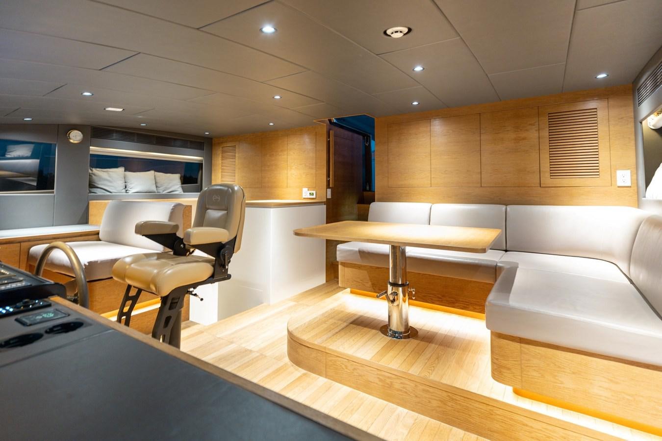 a room with tables and chairs aboard ADAGIO Yacht for Sale