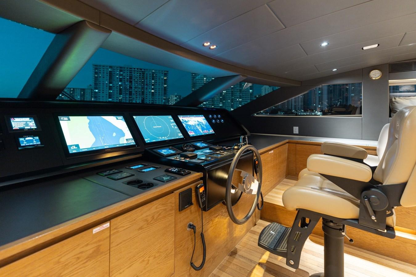a room with a large tv and several screens aboard ADAGIO Yacht for Sale