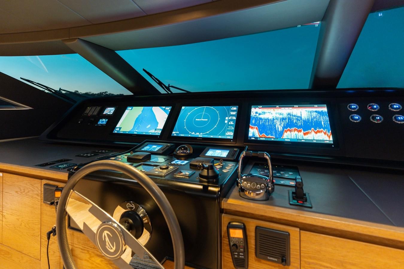 a group of monitors and electronics on a desk aboard ADAGIO Yacht for Sale