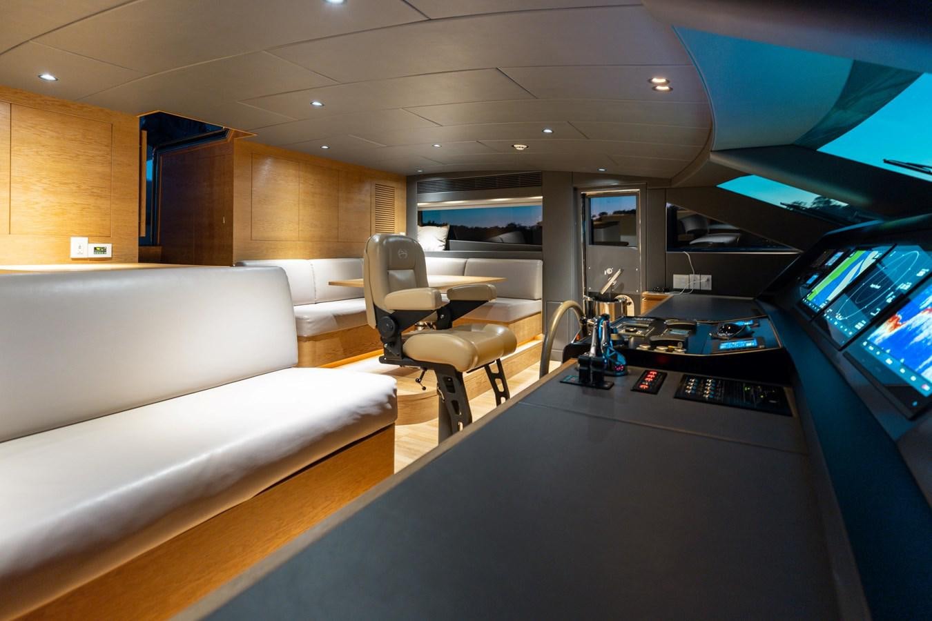 a room with a desk and a couch aboard ADAGIO Yacht for Sale