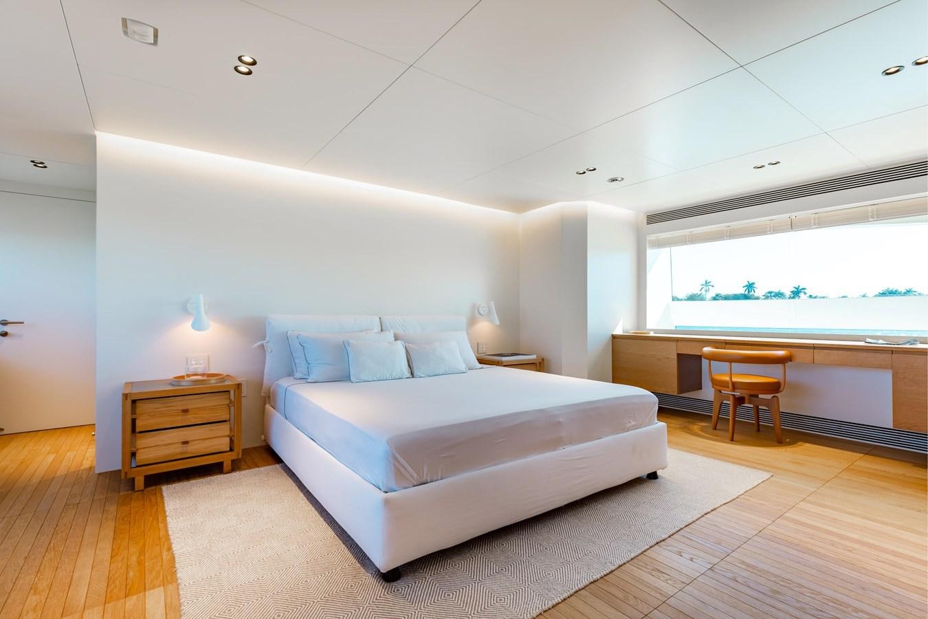 a room with a bed and a table aboard ADAGIO Yacht for Sale