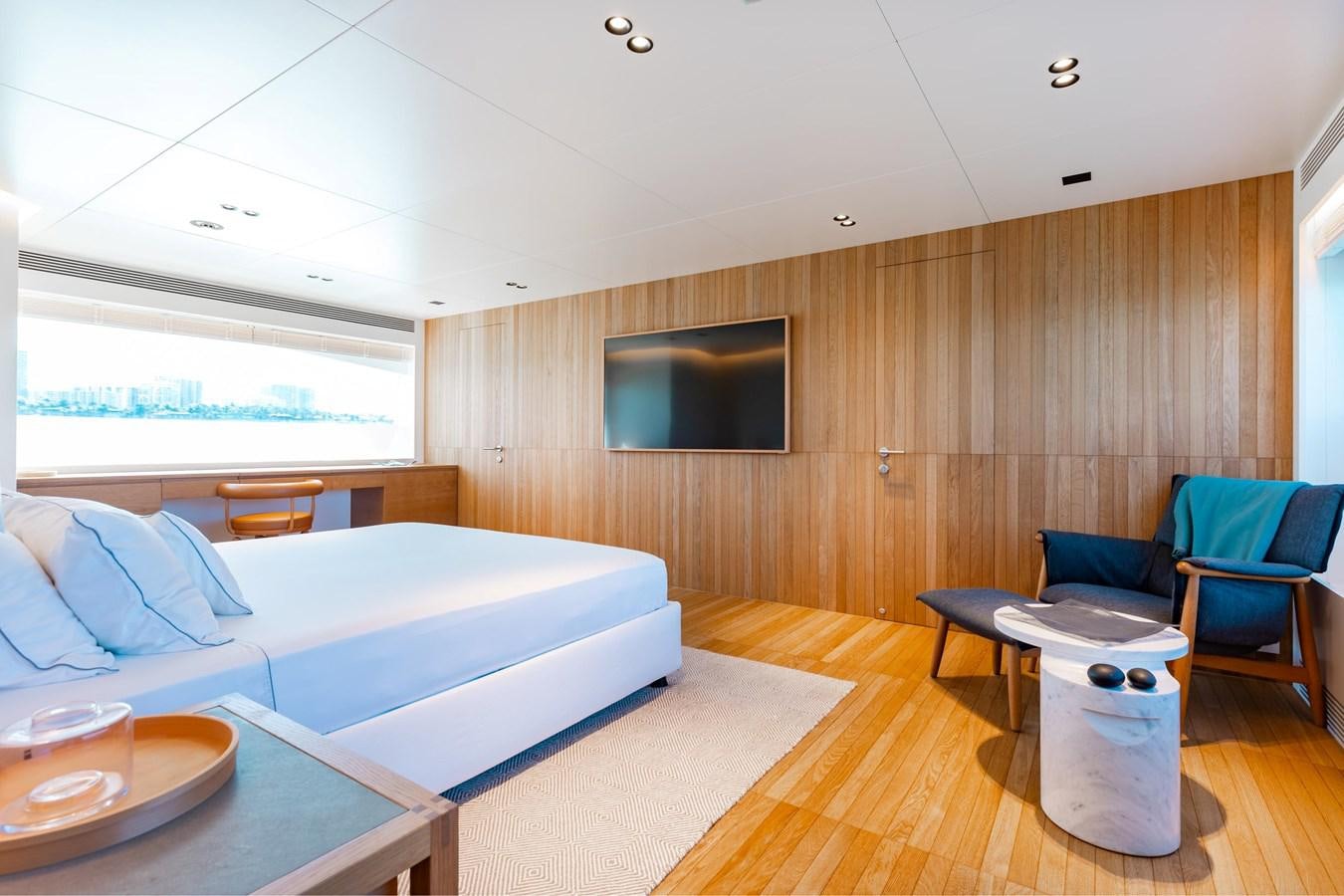 a living room with a wood wall aboard ADAGIO Yacht for Sale