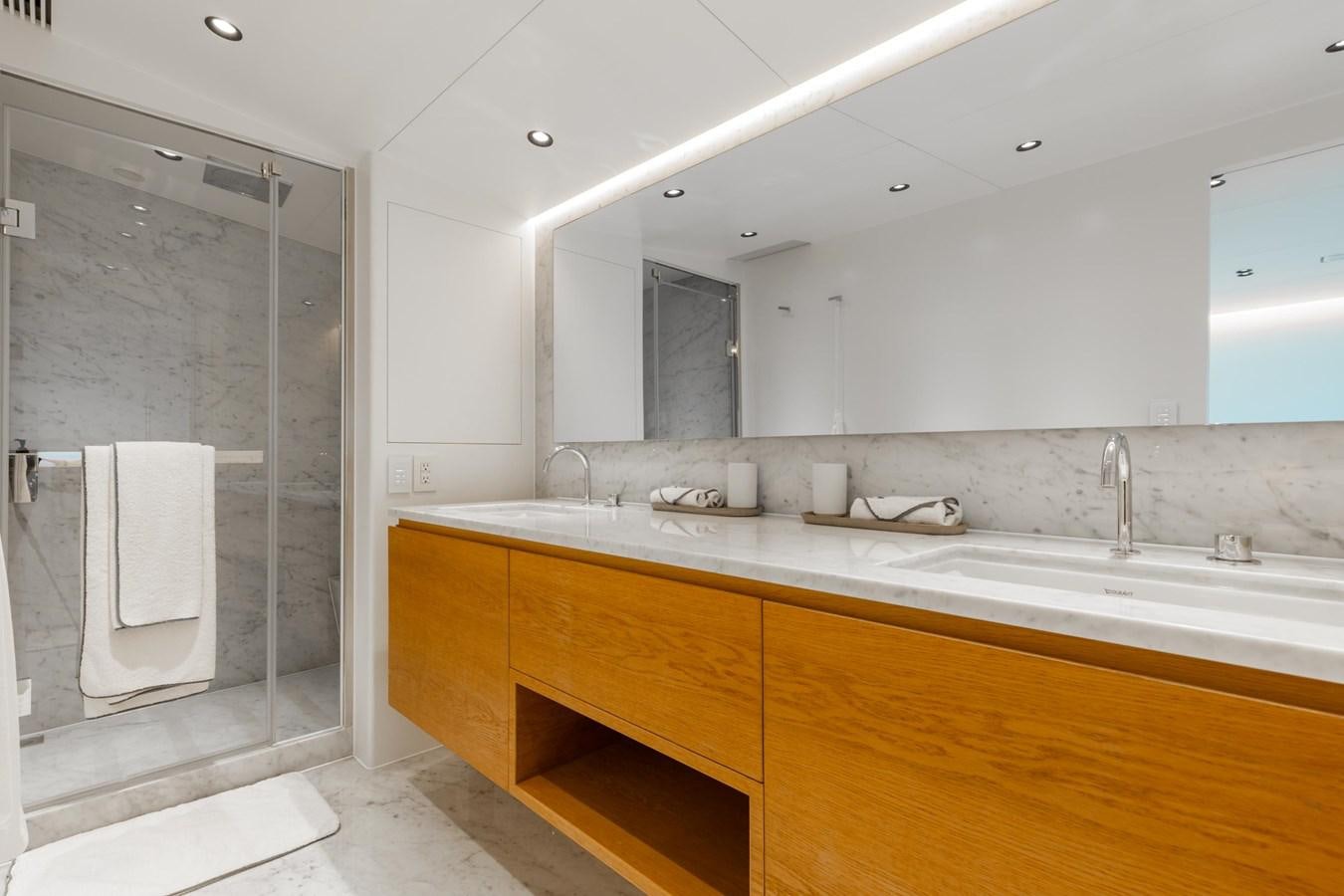 a bathroom with a glass shower aboard ADAGIO Yacht for Sale