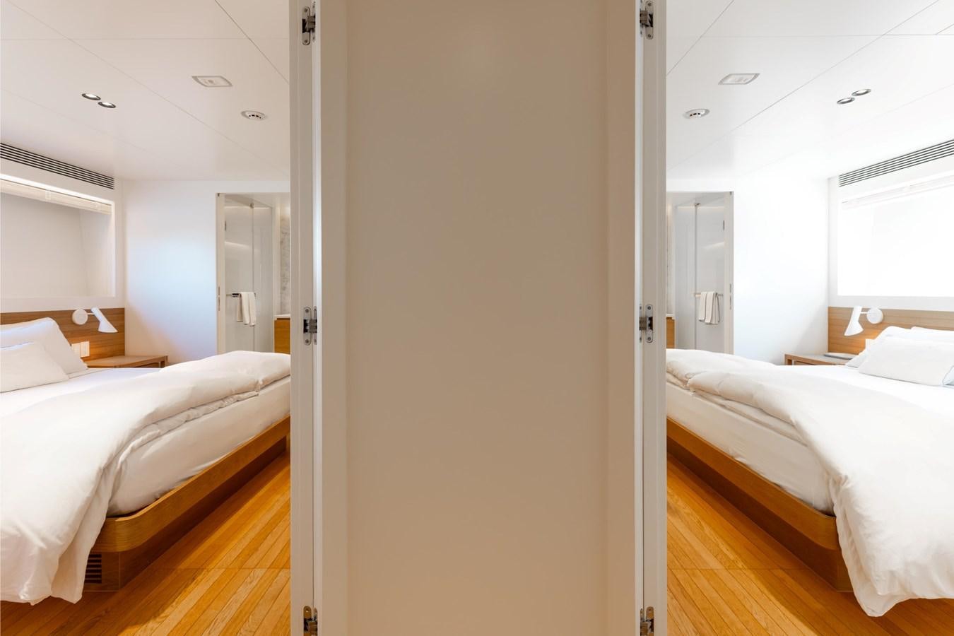 a room with two beds aboard ADAGIO Yacht for Sale