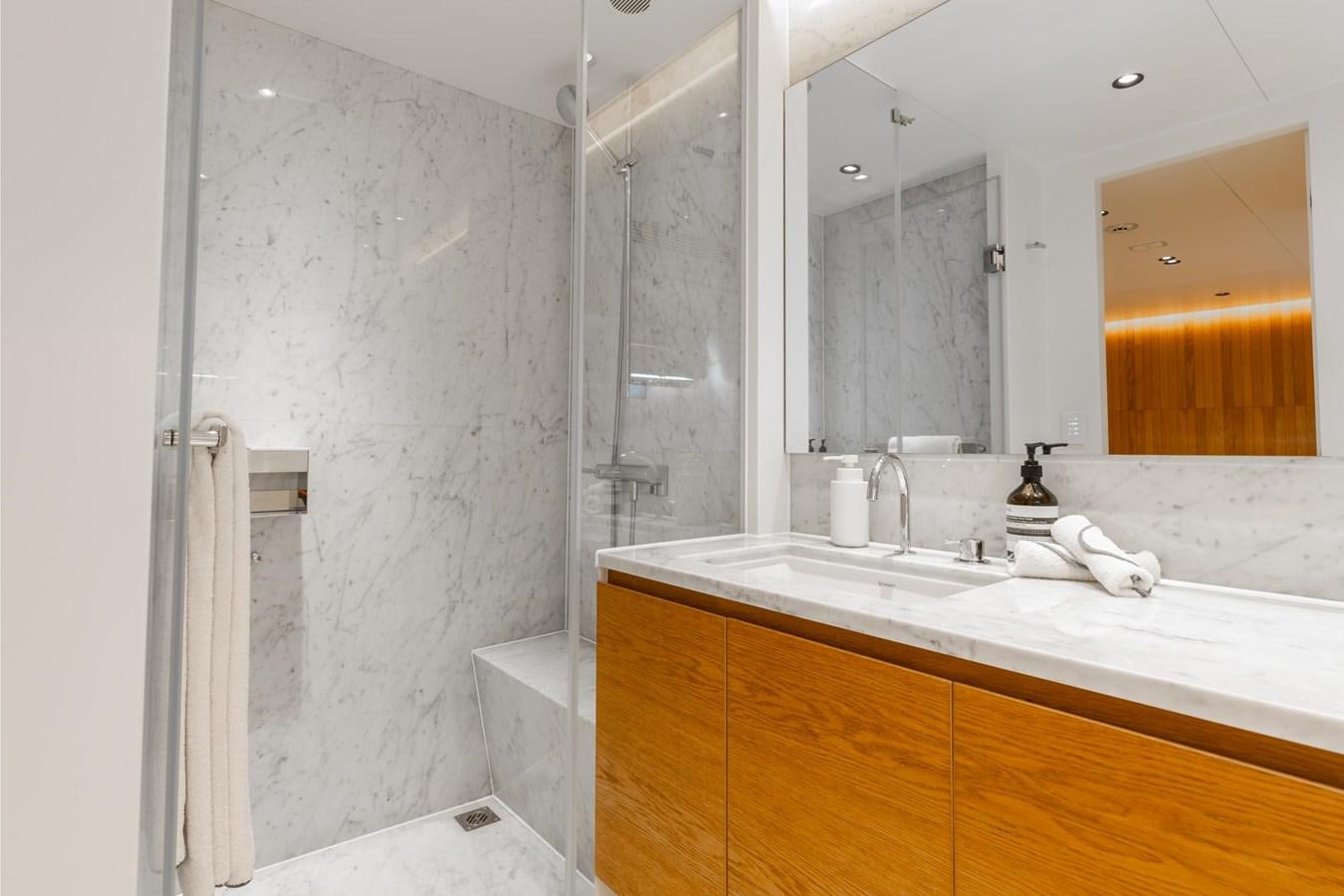 a bathroom with a large mirror aboard ADAGIO Yacht for Sale