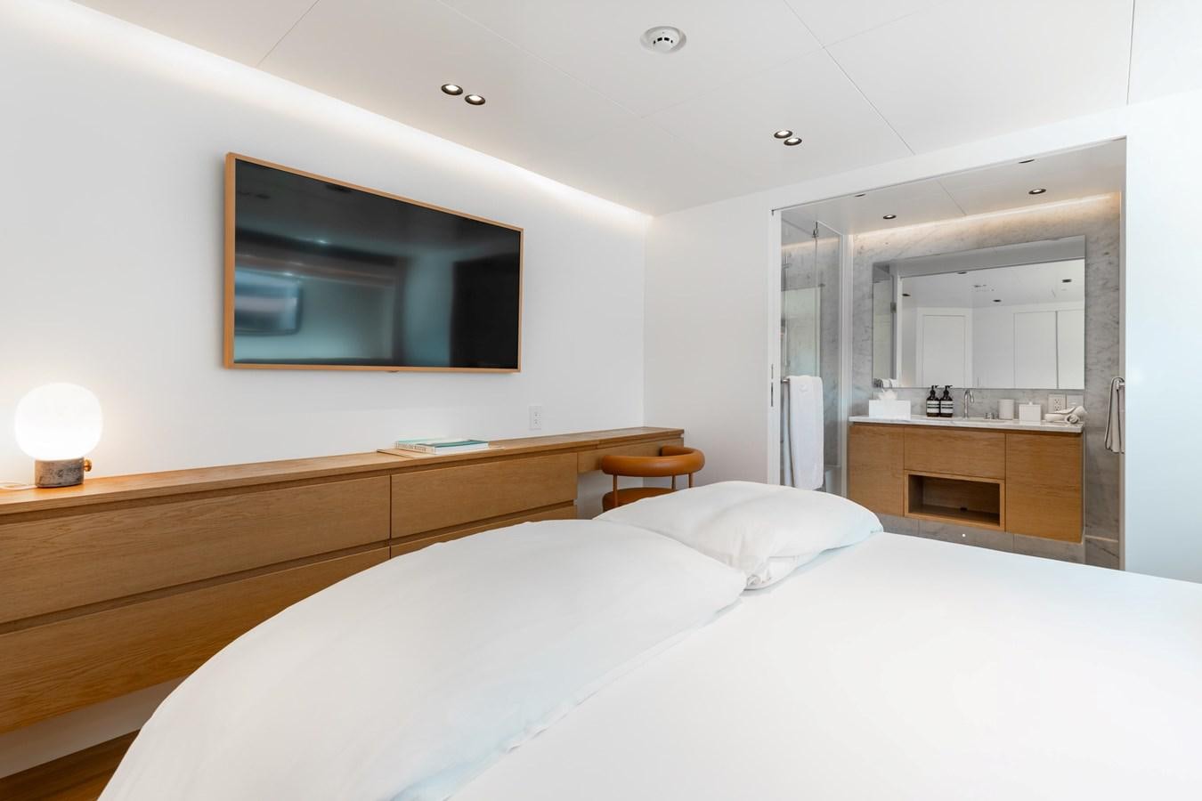 a bedroom with a large bed aboard ADAGIO Yacht for Sale