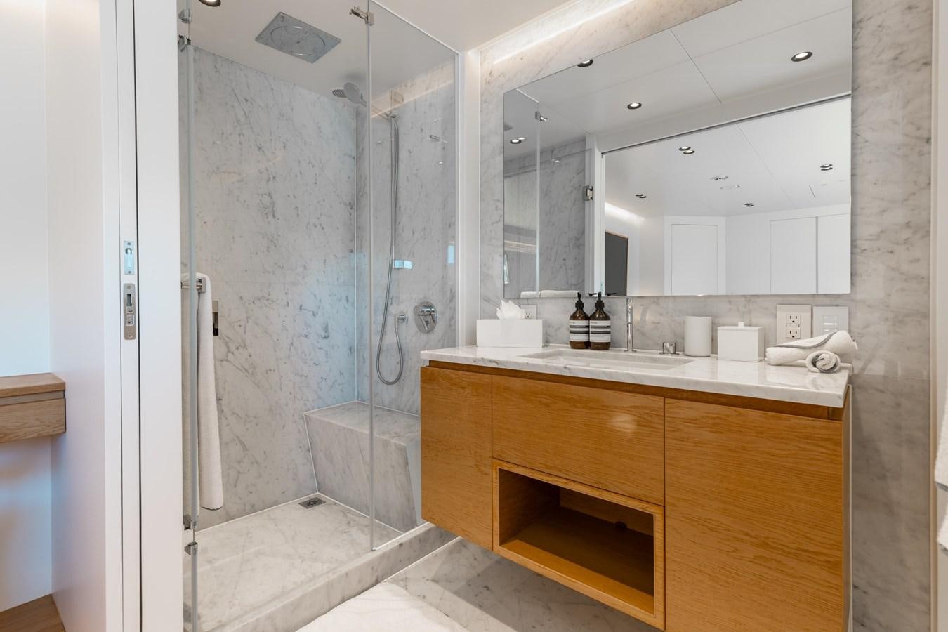 a bathroom with a sink and a shower aboard ADAGIO Yacht for Sale