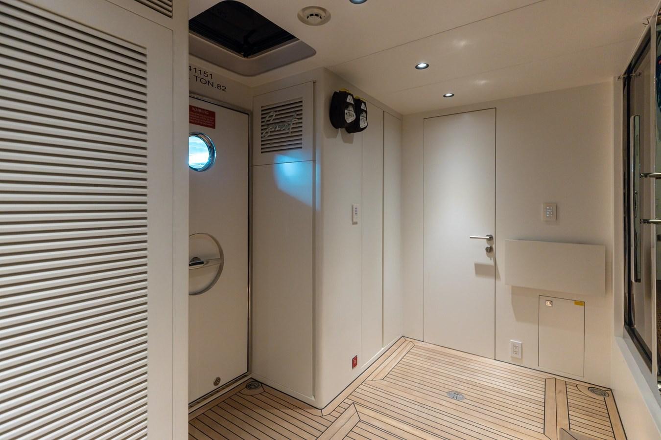 a room with a bed and a television aboard ADAGIO Yacht for Sale