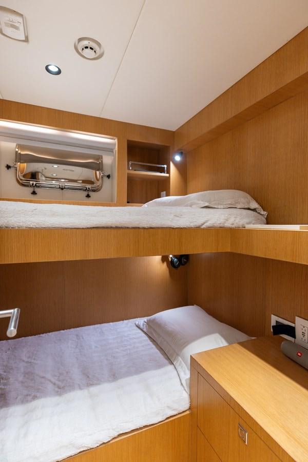a bed with a white sheet aboard ADAGIO Yacht for Sale