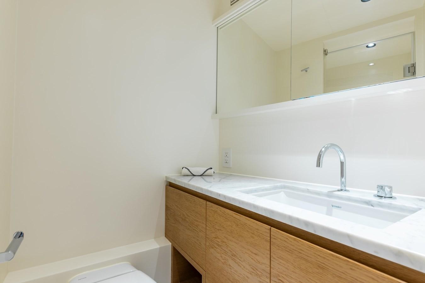 a bathroom with a sink and a mirror aboard ADAGIO Yacht for Sale