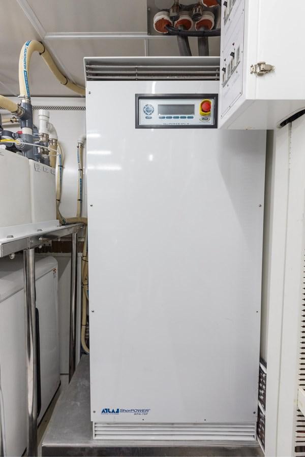 a white refrigerator with a blue handle aboard ADAGIO Yacht for Sale