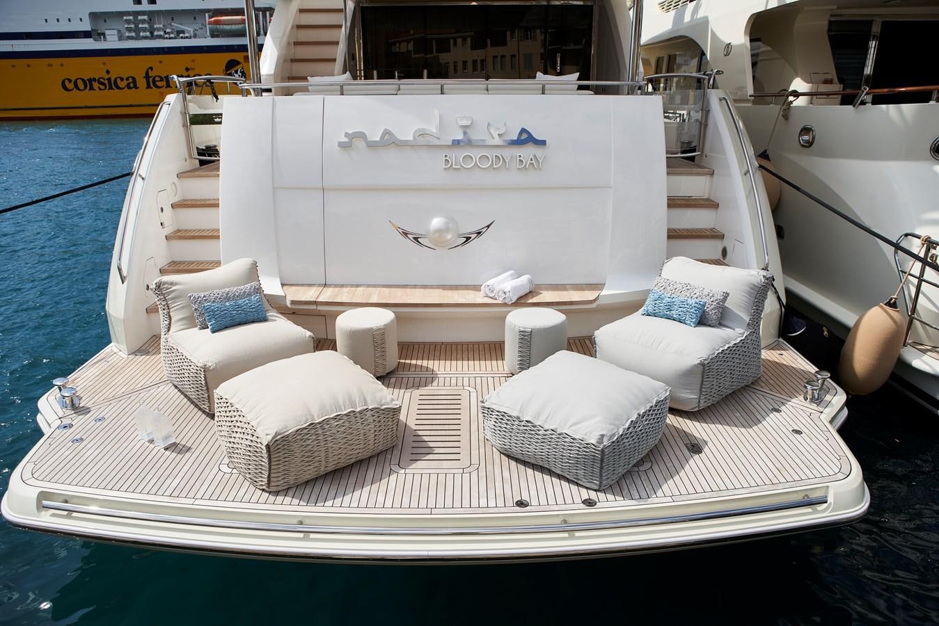 a white couch in a swimming pool aboard NADIRA Yacht for Sale