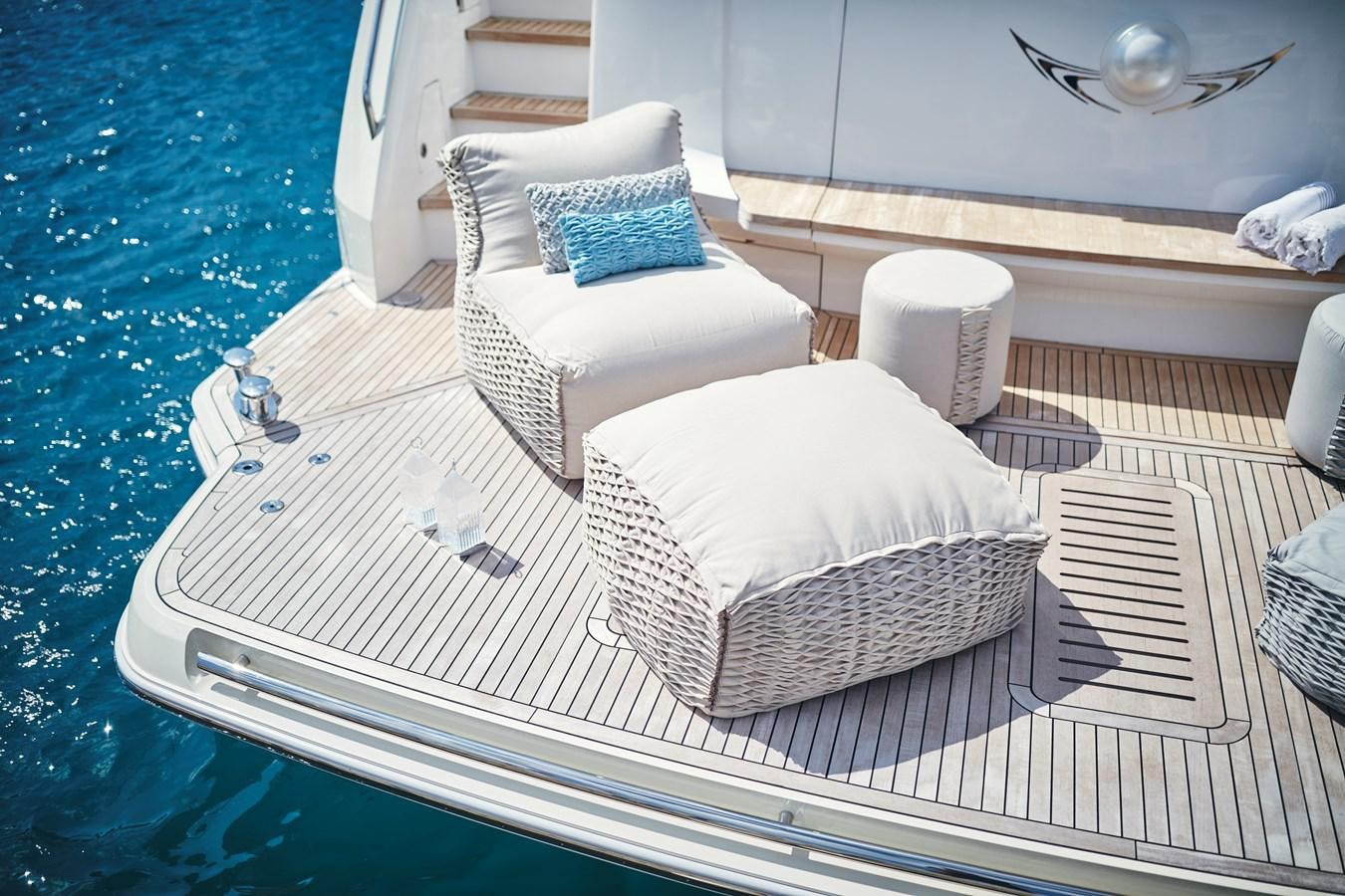 a bed with a white cover aboard NADIRA Yacht for Sale