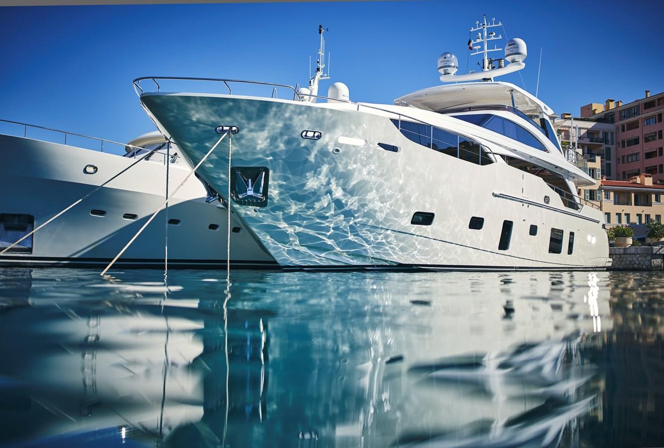 a large white boat in the water aboard NADIRA Yacht for Sale