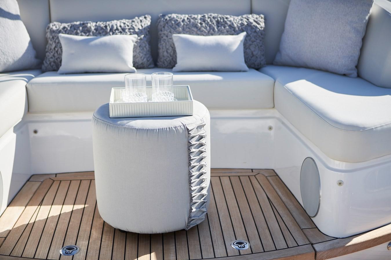 a white couch with a blue couch aboard NADIRA Yacht for Sale