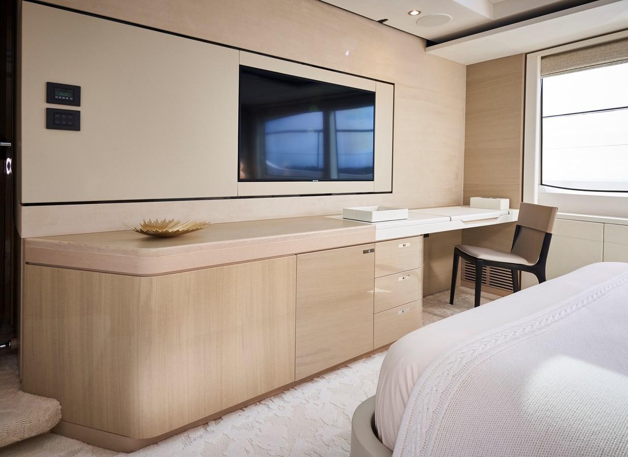 a room with a bed and a tv on the wall aboard NADIRA Yacht for Sale