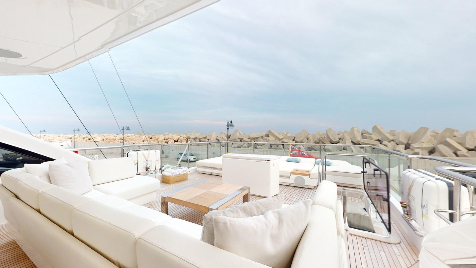 a deck with a view of the city aboard NADIRA Yacht for Sale