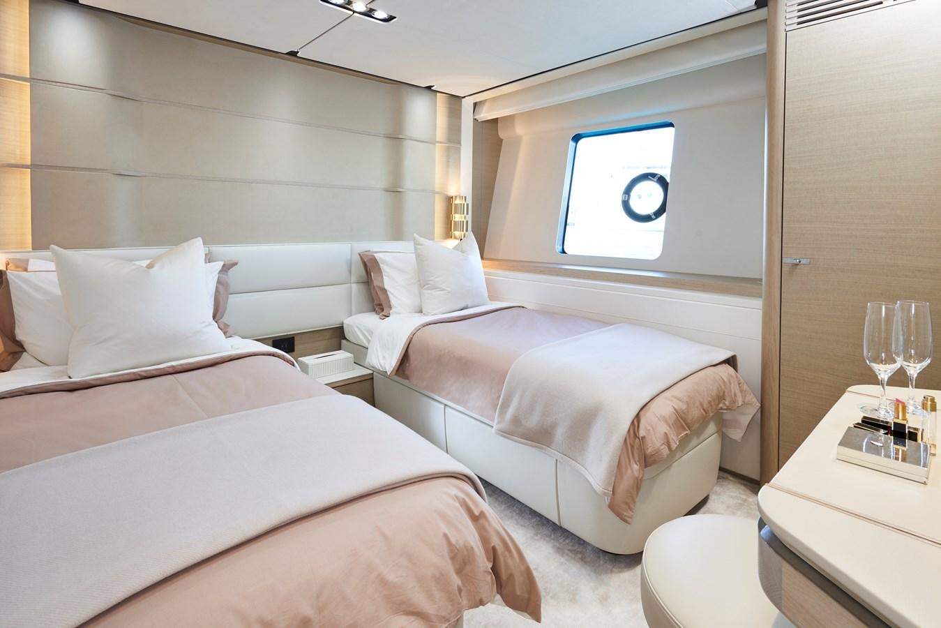 a room with two beds aboard NADIRA Yacht for Sale