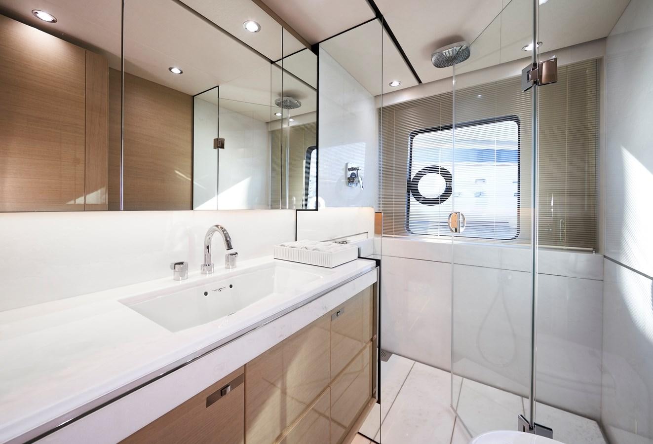 a bathroom with a large mirror aboard NADIRA Yacht for Sale