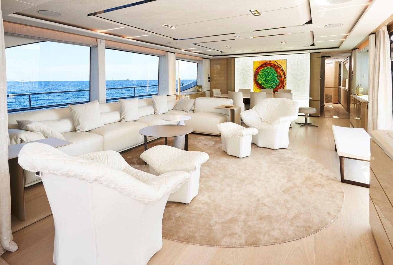 a large living room with a large window aboard NADIRA Yacht for Sale