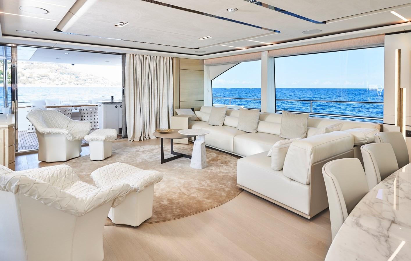 a living room with a large window aboard NADIRA Yacht for Sale