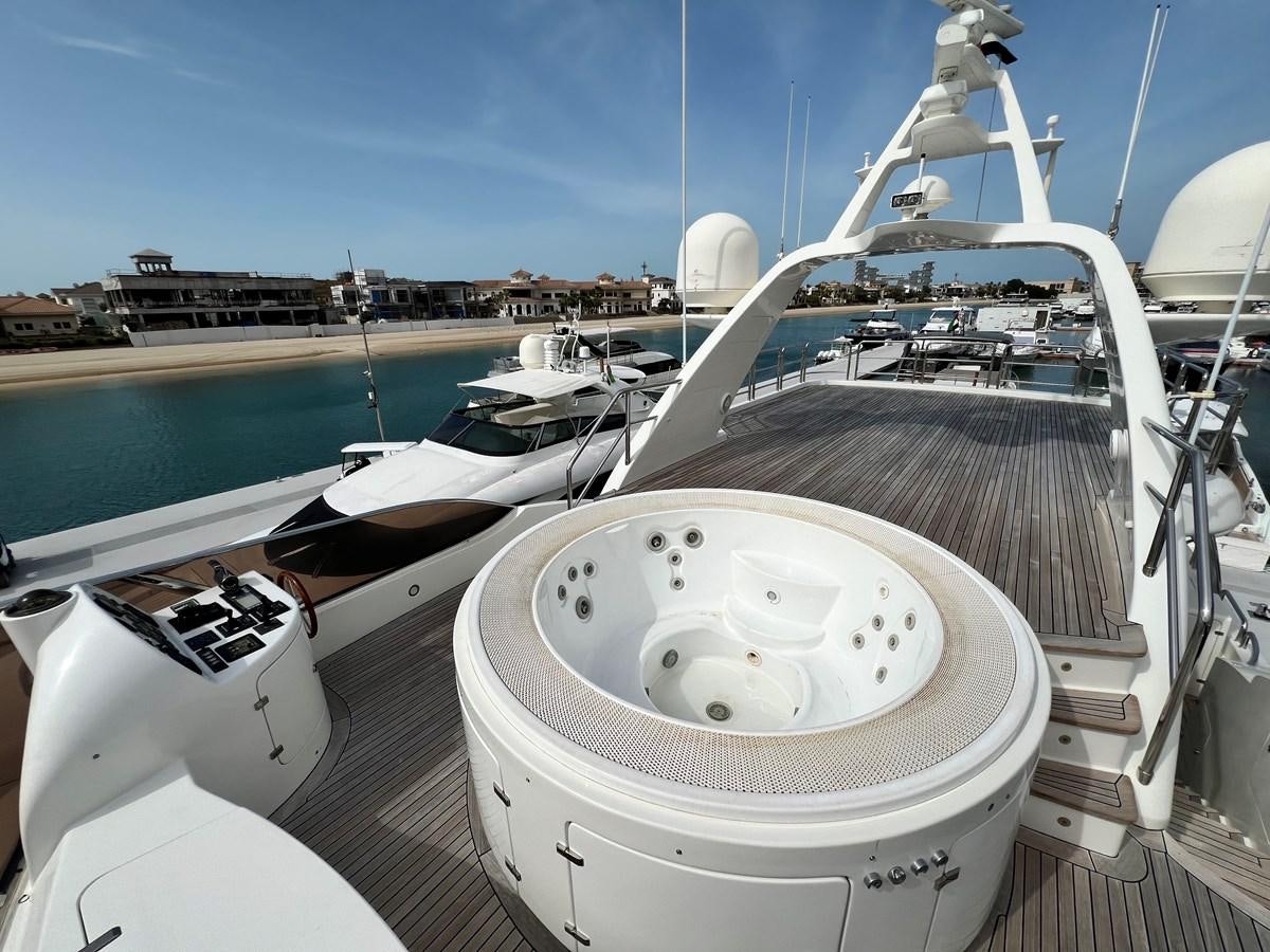 a boat docked at a pier aboard BENETTI 100 Yacht for Sale