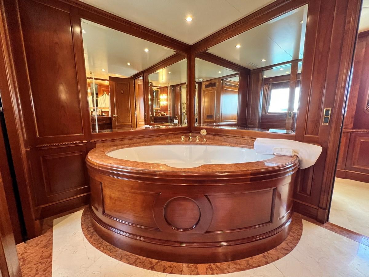 a large jacuzzi tub in a bathroom aboard BENETTI 100 Yacht for Sale
