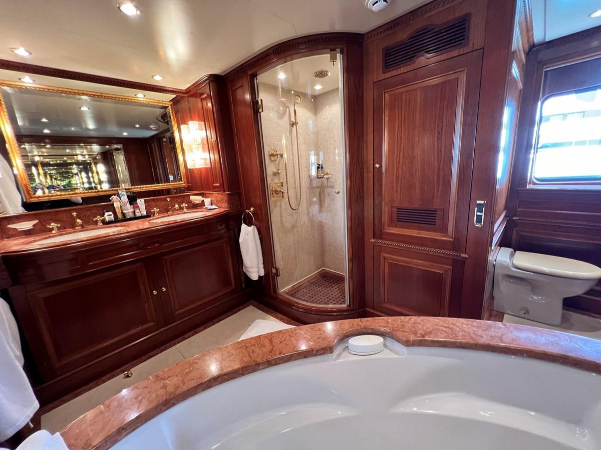 a bathroom with a bathtub and a sink aboard BENETTI 100 Yacht for Sale
