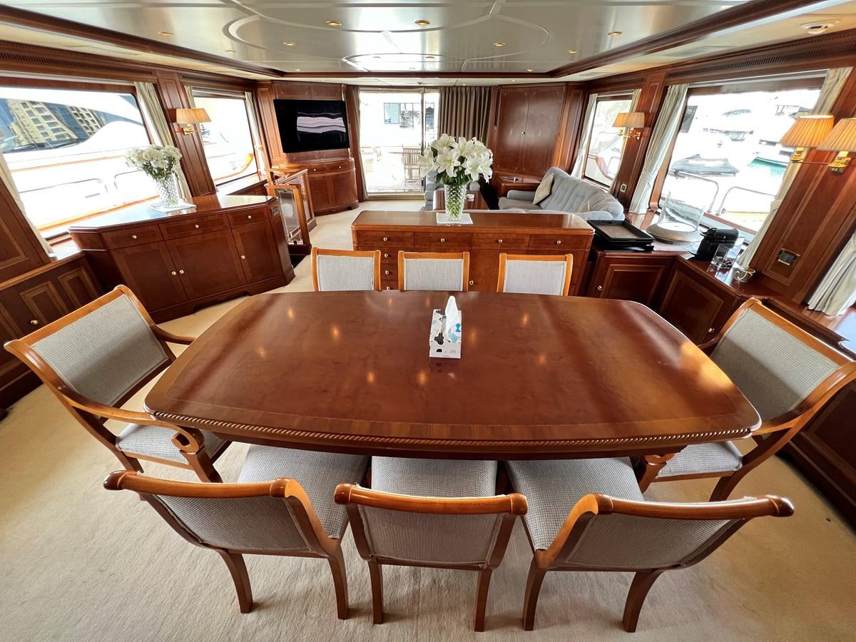 a large wooden table in a restaurant aboard BENETTI 100 Yacht for Sale