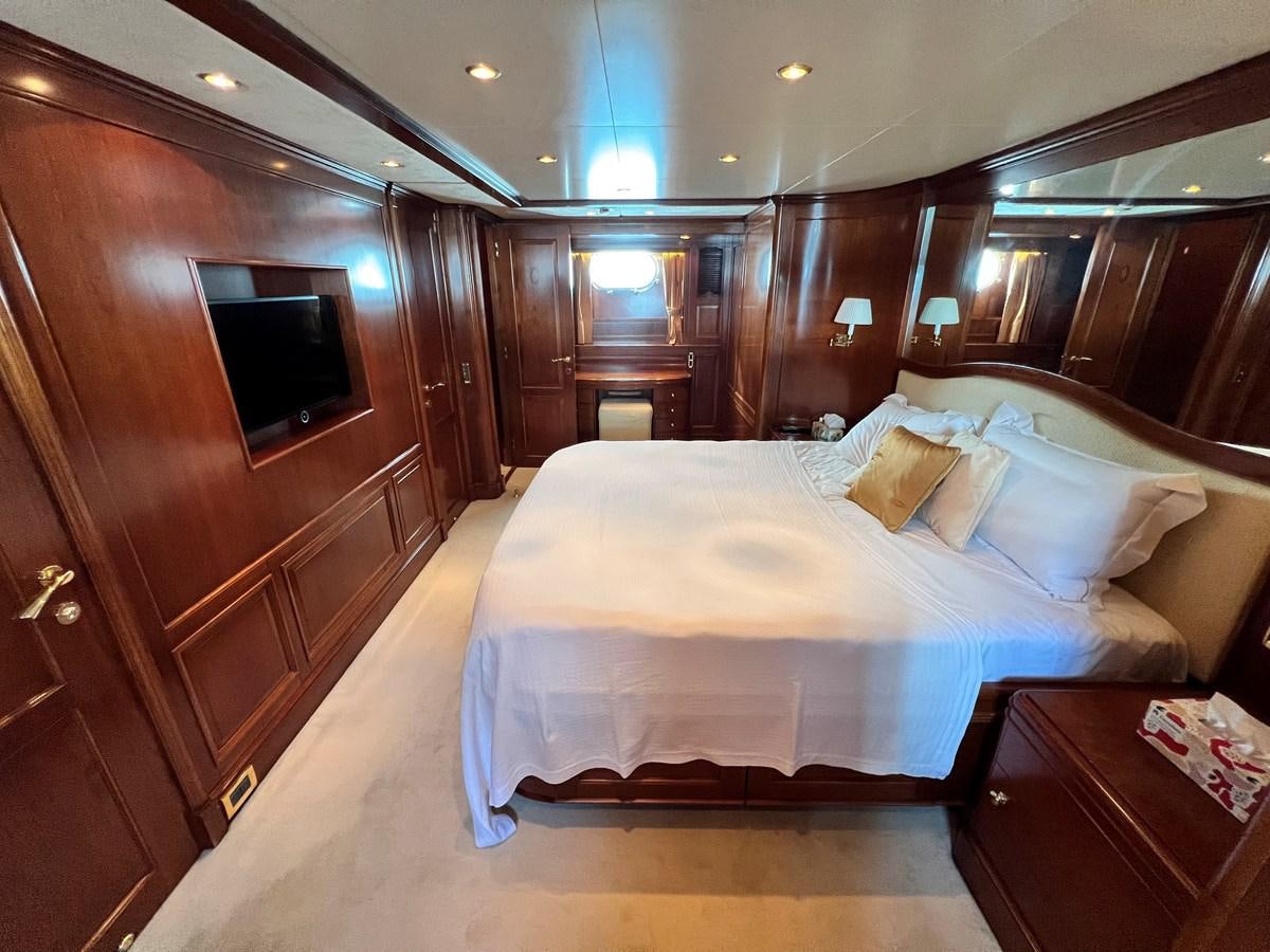 a bed in a room aboard BENETTI 100 Yacht for Sale