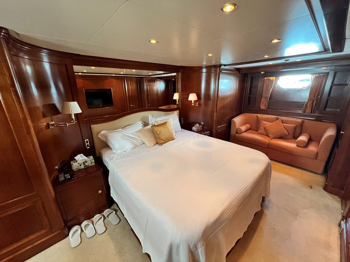 a hotel room with a bed and a couch aboard BENETTI 100 Yacht for Sale