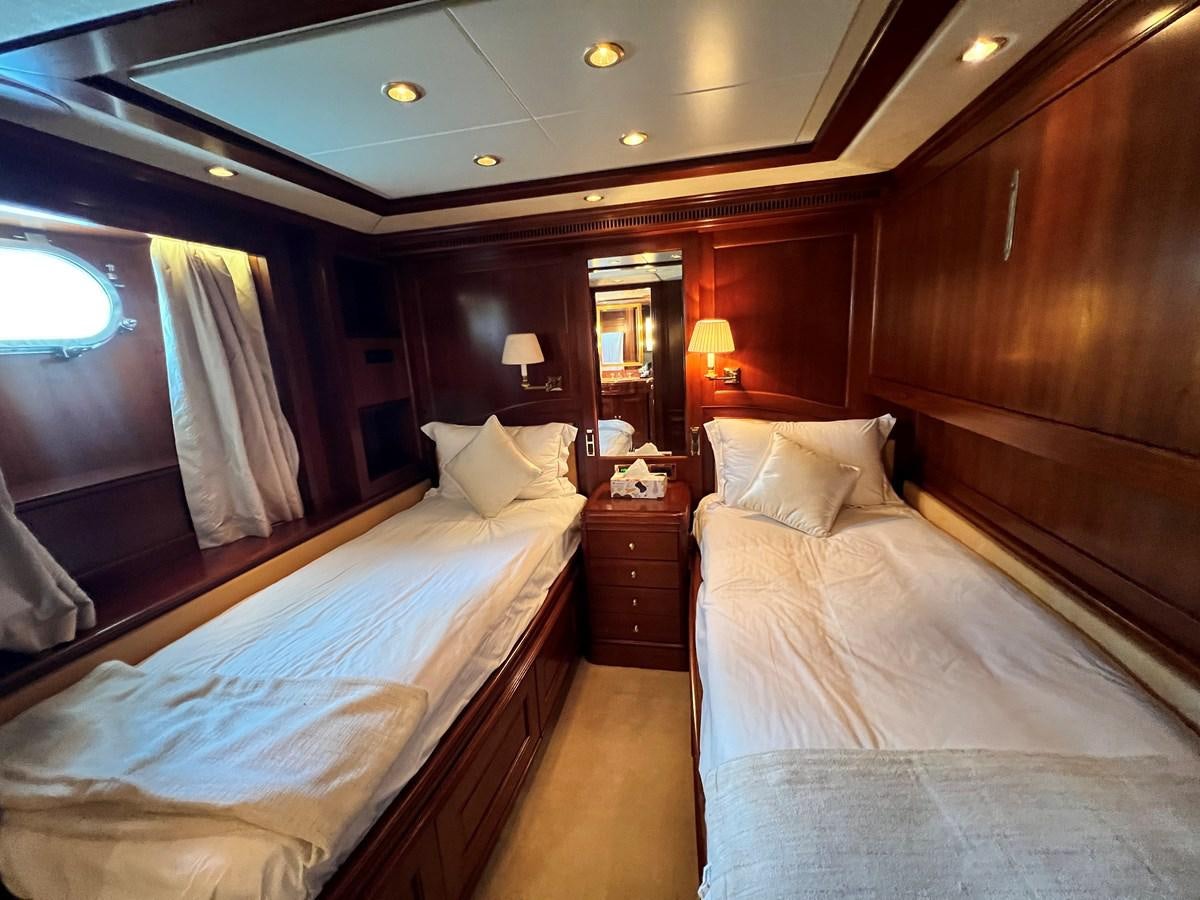 a room with two beds aboard BENETTI 100 Yacht for Sale