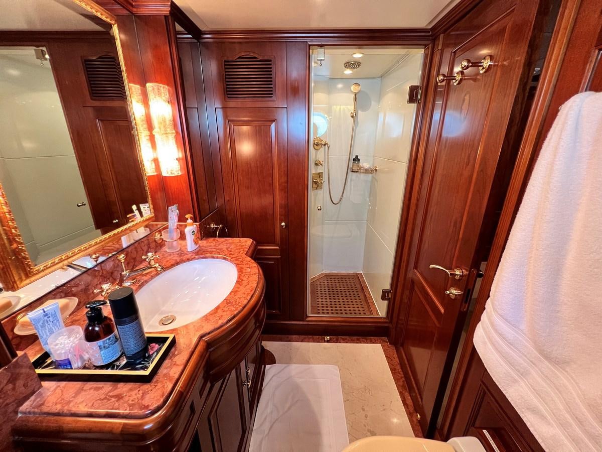 a bathroom with a sink and a bathtub aboard BENETTI 100 Yacht for Sale