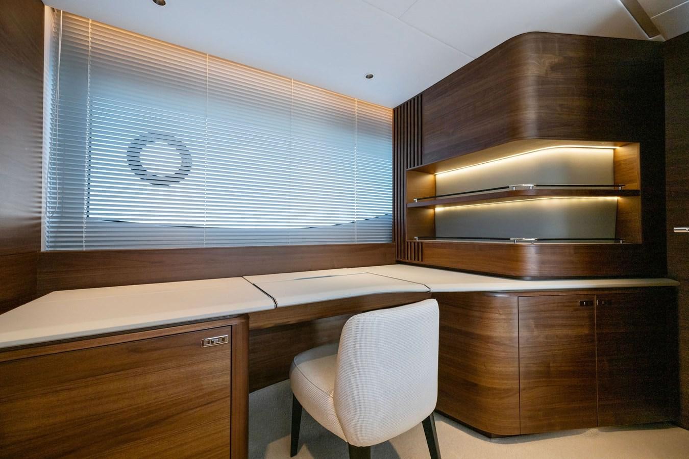 a room with a white chair and cabinets aboard ELIZABETH Yacht for Sale