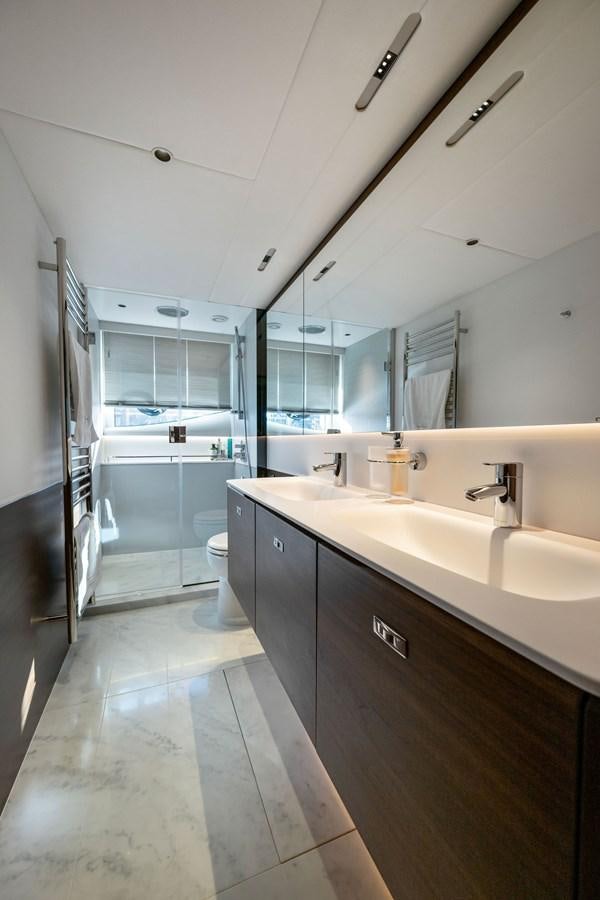 a bathroom with a large mirror aboard ELIZABETH Yacht for Sale