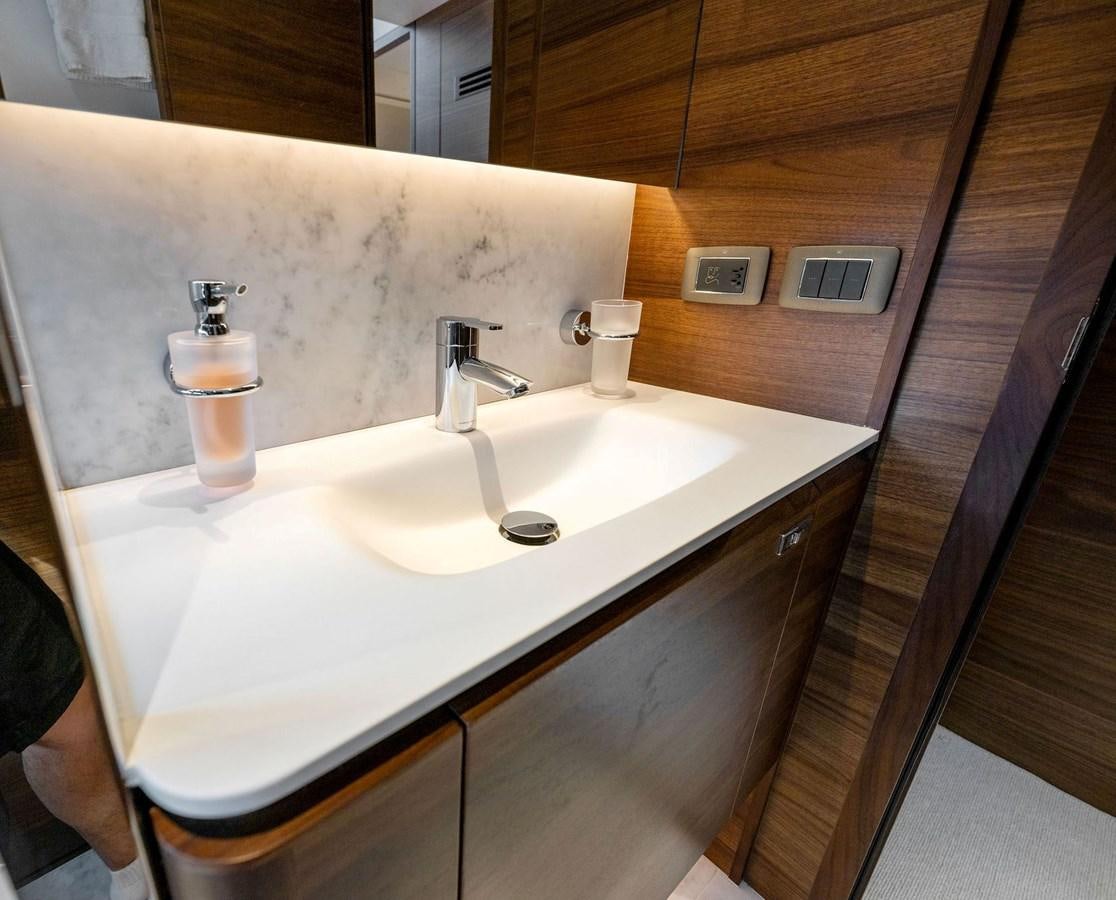 a bathroom sink with a mirror aboard ELIZABETH Yacht for Sale