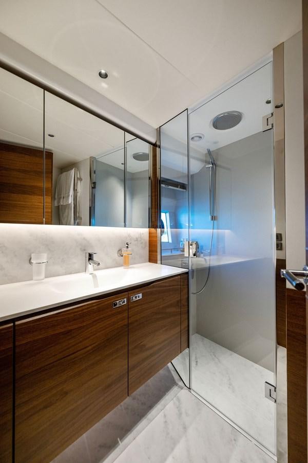 a bathroom with a large mirror aboard ELIZABETH Yacht for Sale