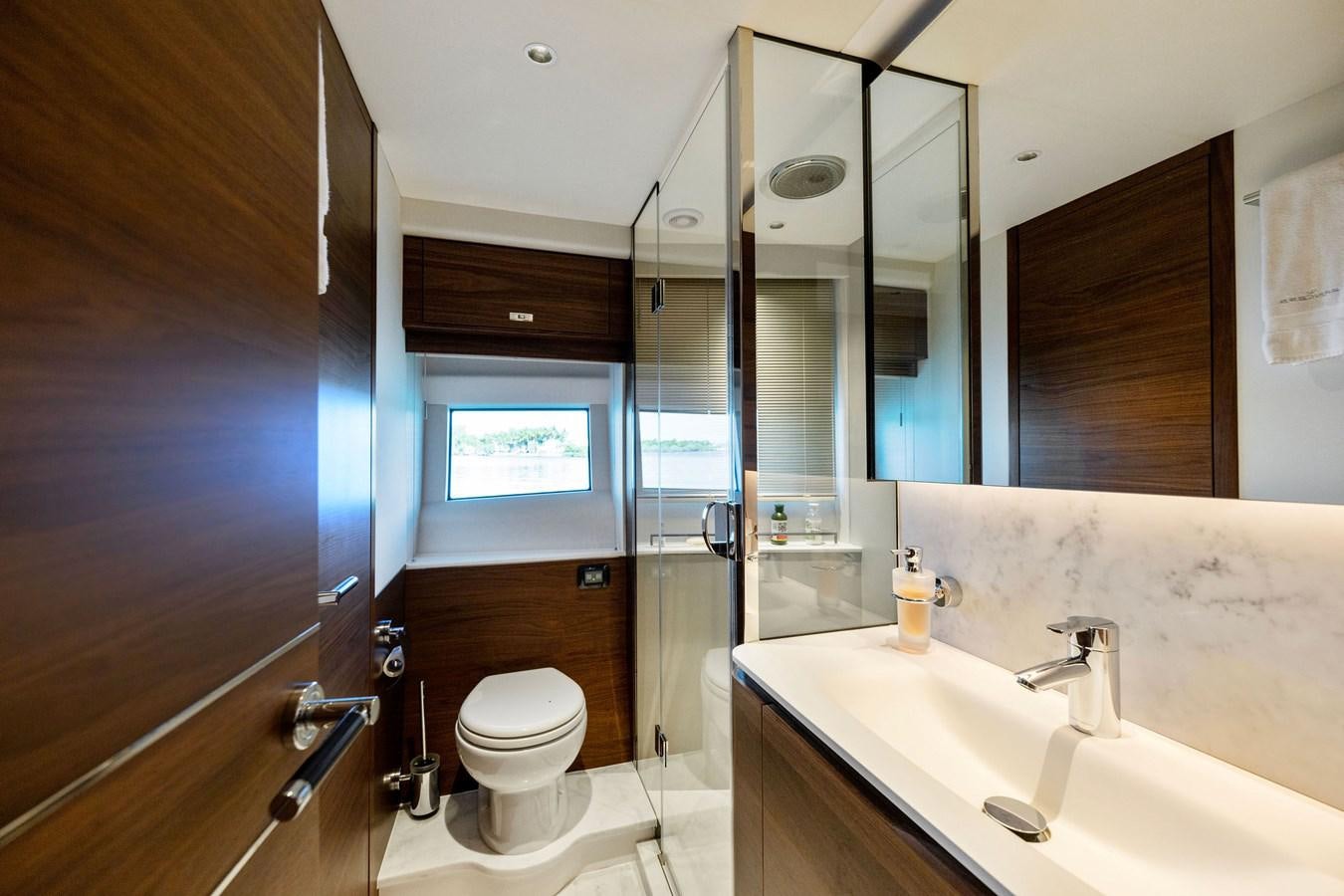 a bathroom with a glass shower aboard ELIZABETH Yacht for Sale