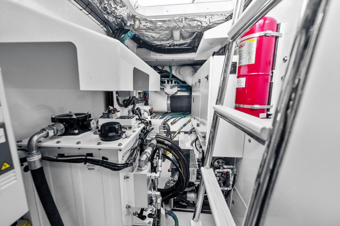 a white vehicle with wires and a red and black object in the back aboard ELIZABETH Yacht for Sale