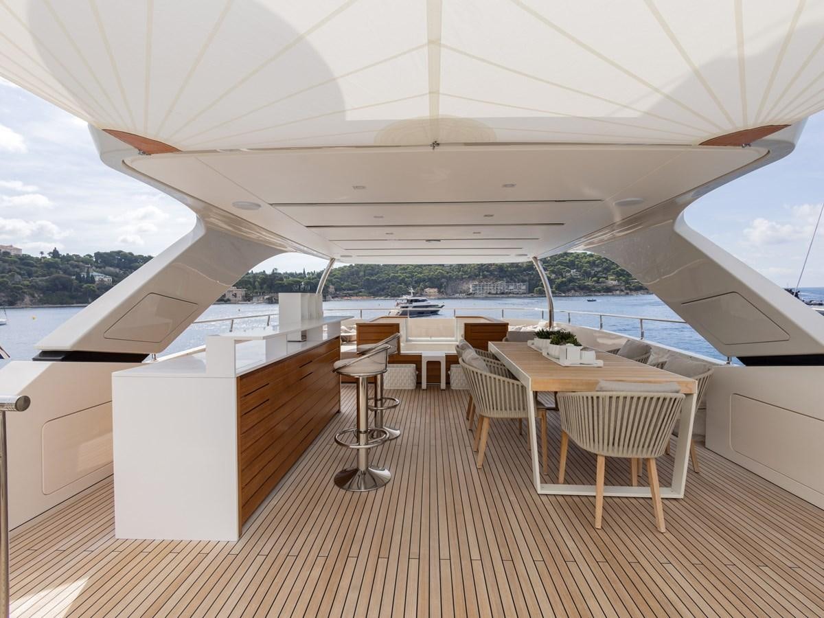 a room with tables and chairs aboard MOCEAN II Yacht for Sale