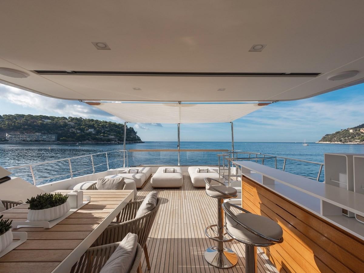 a deck overlooking a large body of water aboard MOCEAN II Yacht for Sale