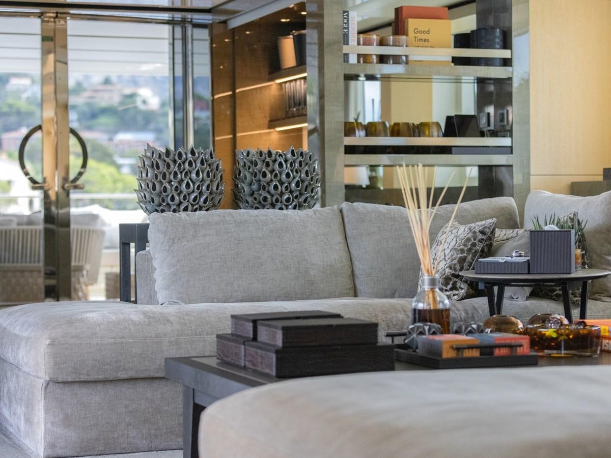 a living room with a couch and a coffee table aboard MOCEAN II Yacht for Sale