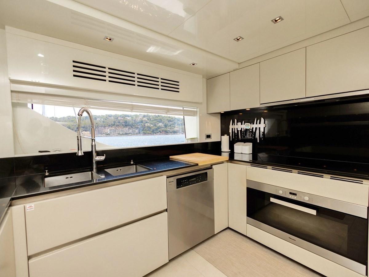 a kitchen with a sink and a microwave aboard MOCEAN II Yacht for Sale