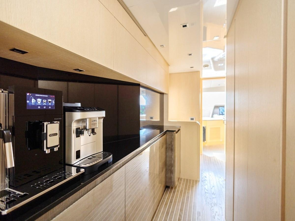 a large kitchen with a large tv aboard MOCEAN II Yacht for Sale