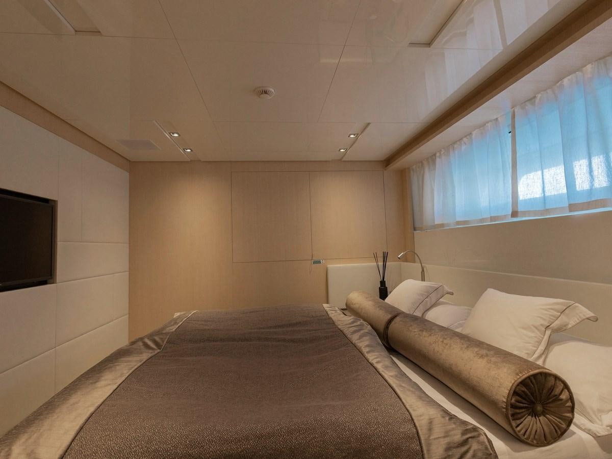 a room with a bed and a television aboard MOCEAN II Yacht for Sale
