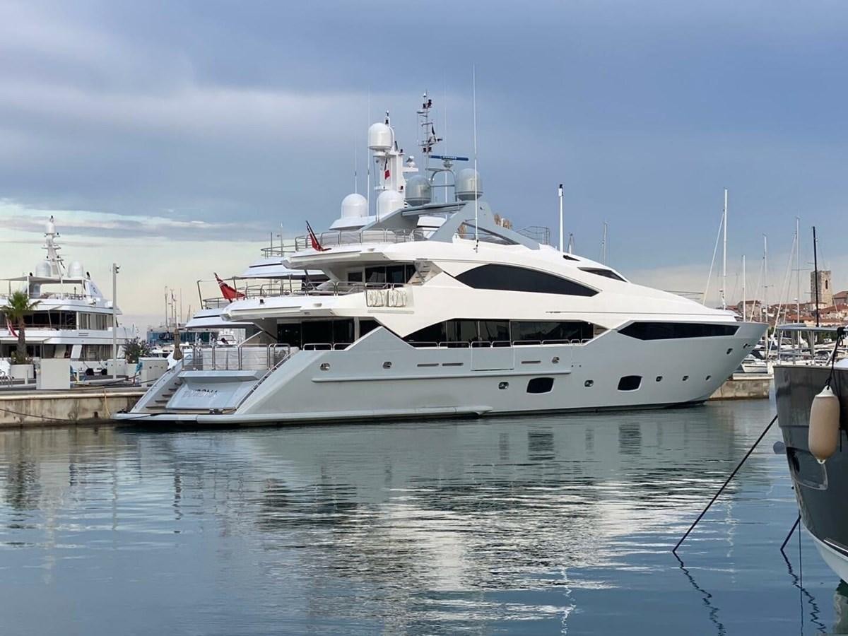 a white yacht docked aboard SUNSEEKER 131 2012 40 M Yacht for Sale