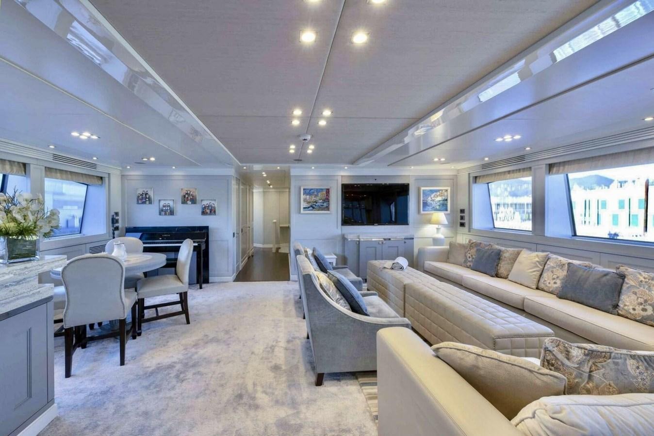 a living room with a couch and a table aboard SUNSEEKER 131 2012 40 M Yacht for Sale
