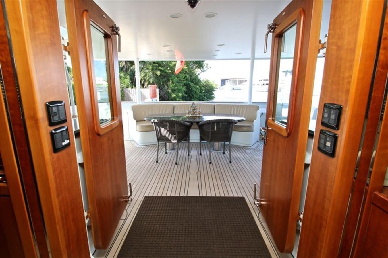 a room with a table and chairs aboard IMPETUS Yacht for Sale