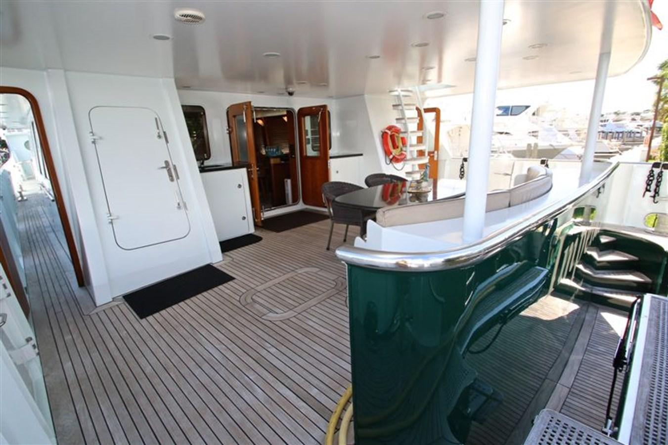 a room with a table and chairs aboard IMPETUS Yacht for Sale